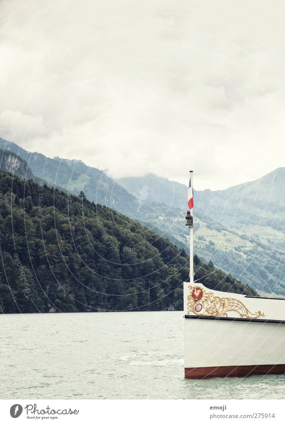 swissness Environment Nature Water Sky Bad weather Hill Historic Idyll Navigation Watercraft Bow Colour photo Subdued colour Exterior shot Deserted