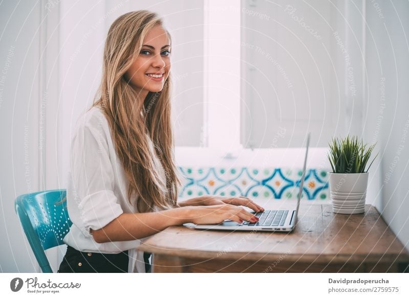 Young beautiful blonde woman on the computer working Woman Portrait photograph Room Smiling Youth (Young adults) Sit Computer Technology Work and employment