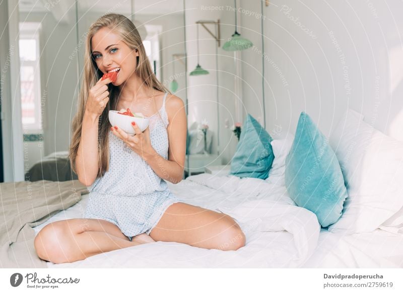 Young healthy beautiful blonde woman in the bed eating fruits Woman Bed Bedroom Blonde Portrait photograph Fruit Food To feed Smiling Youth (Young adults) Girl