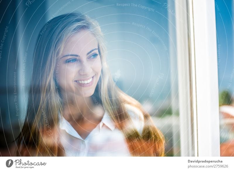 Young thoughtful woman looking through the window Woman Blonde Youth (Young adults) Considerate pretty Portrait photograph Window Close-up Life Home Happy