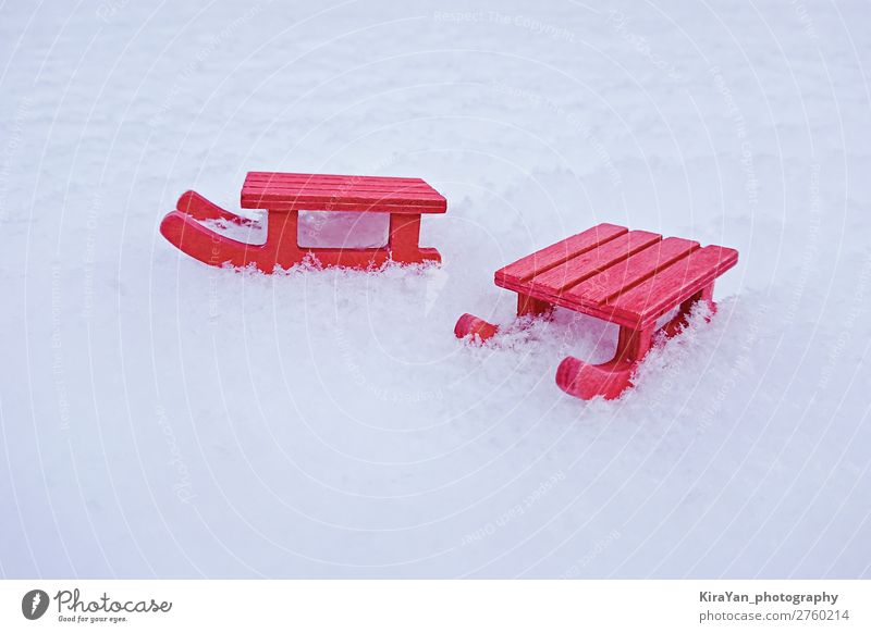 Miniature red sled on white snow Lifestyle Style Design Joy Leisure and hobbies Vacation & Travel Winter Snow Decoration Christmas & Advent Infancy Nature