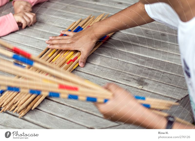 Mikado II Leisure and hobbies Playing 2 Human being 3 - 8 years Child Infancy Touch Arm hands Exterior shot Shallow depth of field