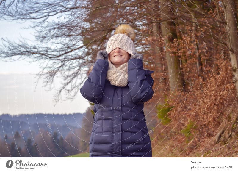 Woman with cap over her face Lifestyle Healthy Harmonious Well-being Contentment Feminine Adults 1 Human being 45 - 60 years Nature Sky Tree Coat Cap Smiling
