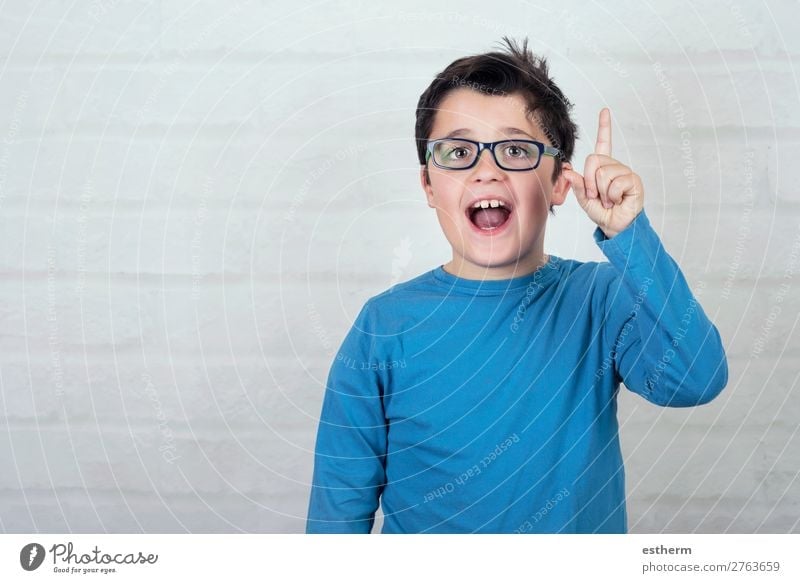 boy in glasses pointing finger up Lifestyle Joy Education Child School Schoolchild Student To talk Human being Masculine Boy (child) Infancy Fingers 1