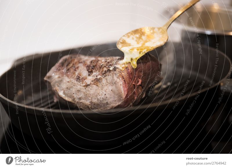 Sauce over a steak in a frying pan Food Meat Nutrition Eating Lunch Dinner Banquet Organic produce Slow food Crockery Pan Spoon Restaurant Barbecue (apparatus)