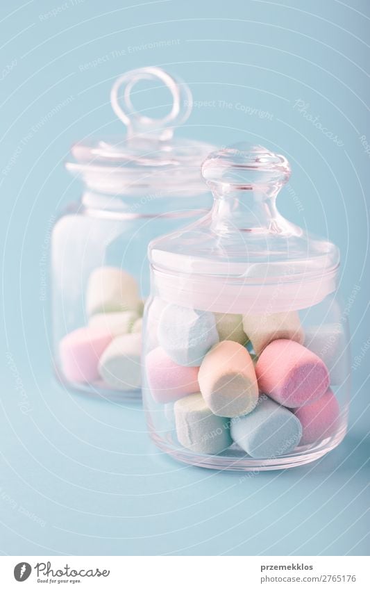 Jar filled with colorful marshmallows on plain background Dessert Candy Nutrition Eating Diet Table Bright Delicious Blue Colour eat food isolated jar pastel