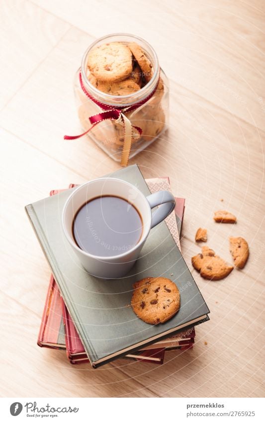 A few books with cup of coffee and cookies on wooden floor Dessert Nutrition Eating Diet Coffee Mug Lifestyle Relaxation Leisure and hobbies Reading Table Book