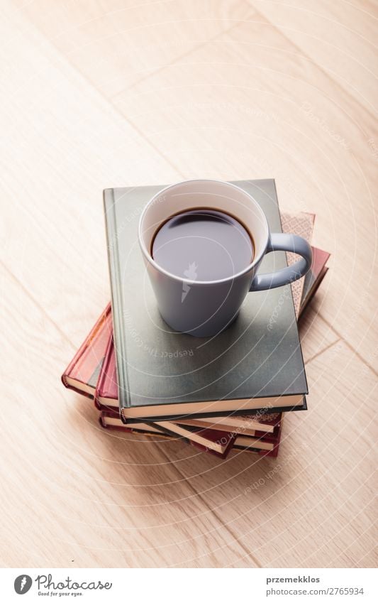 A few books with cup of coffee on wooden floor Coffee Lifestyle Relaxation Leisure and hobbies Reading Table Book To enjoy Brown Safety (feeling of) Comfortable
