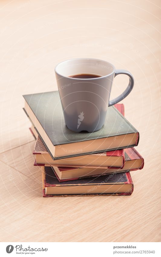 A few books with cup of coffee on wooden floor Coffee Mug Lifestyle Relaxation Leisure and hobbies Reading Chair Table Book To enjoy Safety (feeling of)