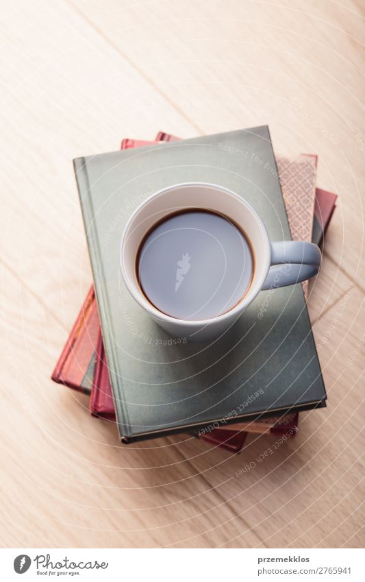 A few books with cup of coffee on wooden floor Coffee Mug Lifestyle Relaxation Leisure and hobbies Reading Chair Table Book To enjoy Safety (feeling of)