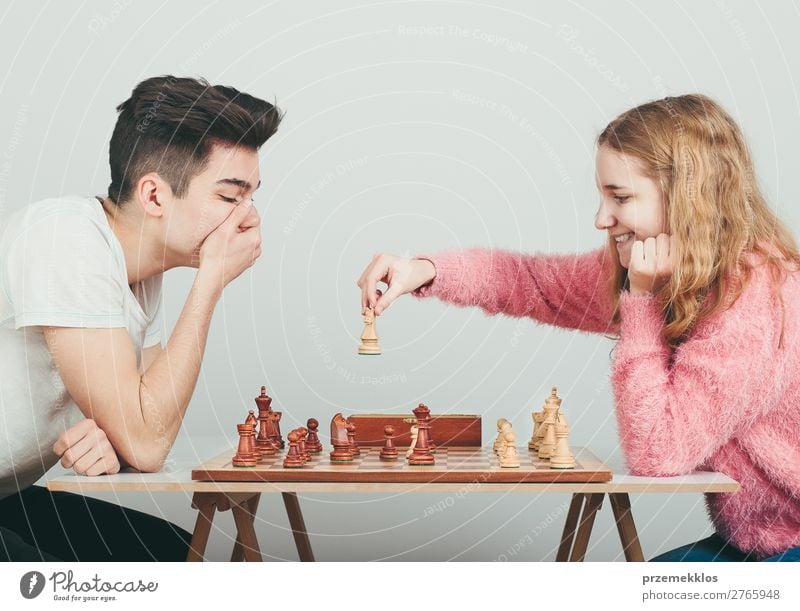 Checkmate. Lifestyle Leisure and hobbies Playing Chess Success Human being Boy (child) Woman Adults Man To enjoy Smart Black White Determination Battle beat