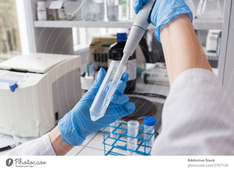 Worker putting liquid to test tube Laboratory Work and employment Science & Research Woman Test tube Liquid pouring Putt Human being Scientist Medication