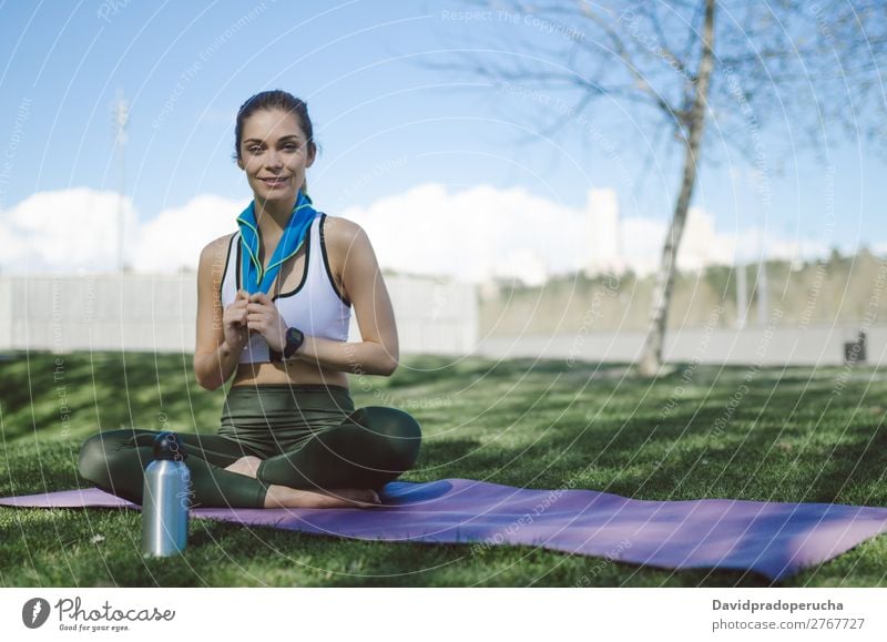 Woman resting and drinking water with towel after workout Lifestyle Beautiful Body Relaxation Meditation Sports Yoga Human being Adults Nature Warmth Park