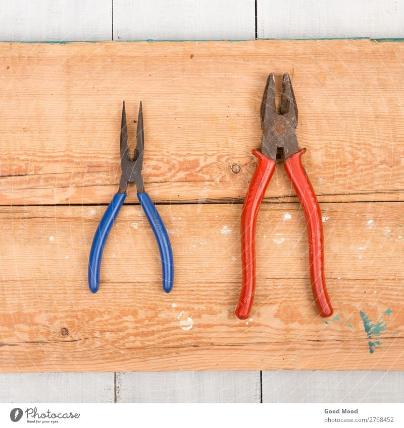 Old pliers on wooden background Table Work and employment Industry Tool Wood Metal Steel Rust Build Dirty Ancient board Carpenter carpentry Conceptual design