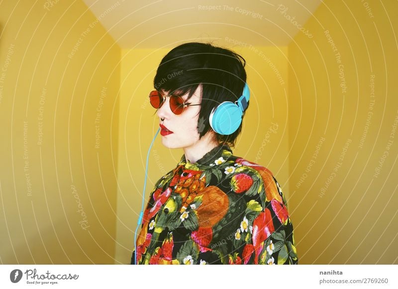 Cool androgynous dj woman in vibrant colors Lifestyle Style Design Exotic Hair and hairstyles Summer Entertainment Party Music Disc jockey Headset Technology