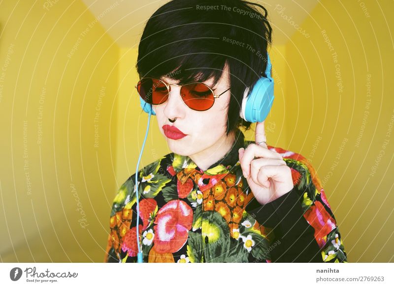Cool androgynous dj woman in vibrant colors Hair and hairstyles Summer Music Disc jockey Headset Technology Entertainment electronics Human being Feminine