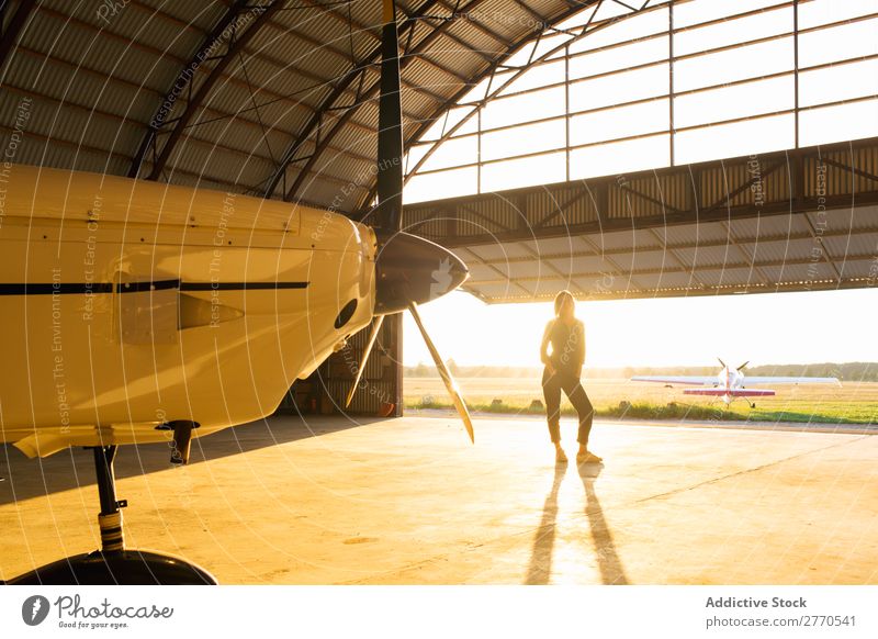 Model inside of hangar Woman Posture Hangar Portrait photograph occupation Vacation & Travel To enjoy Feminine Contentment Transport Youth (Young adults)