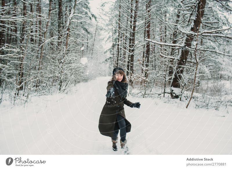 Cheerful woman having fun in winter forest Woman Forest Winter Snow Cold Nature Youth (Young adults) Jump Joy Street Lanes & trails White Beautiful Happy