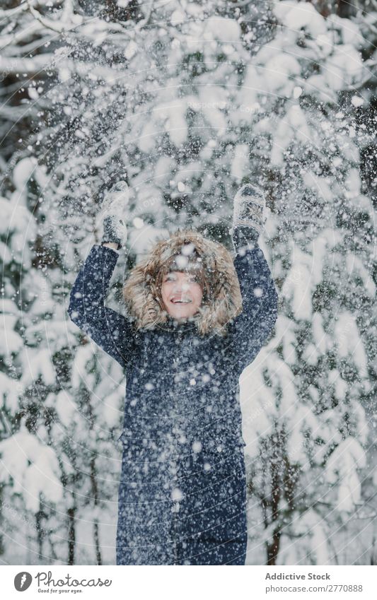 Woman throwing up snow in forest Forest Winter Snow Cold Nature Youth (Young adults) Snowfall White Beautiful Happy Seasons Joy Lifestyle Leisure and hobbies