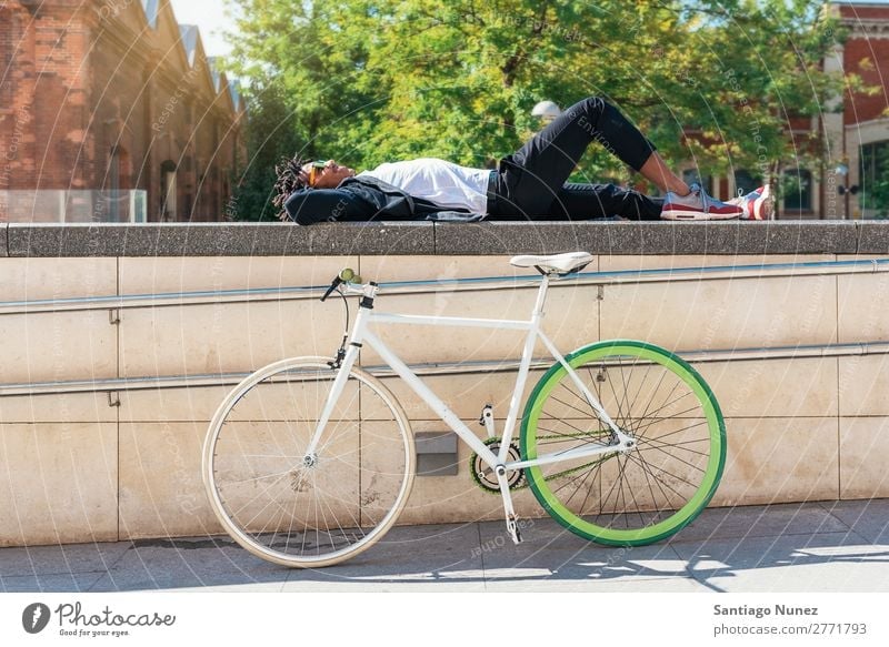 Handsome afro man relaxing near his bike. Man Bicycle fixie Hipster Lifestyle Resting Lie (Untruth) Relaxation enjoying Cycling City Town Human being handsome