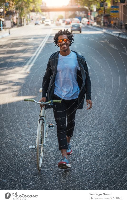 Handsome afro man walking with his bike. Man Youth (Young adults) Afro Black mulatto African Bicycle fixie Hipster Lifestyle Cycling City Town Human being
