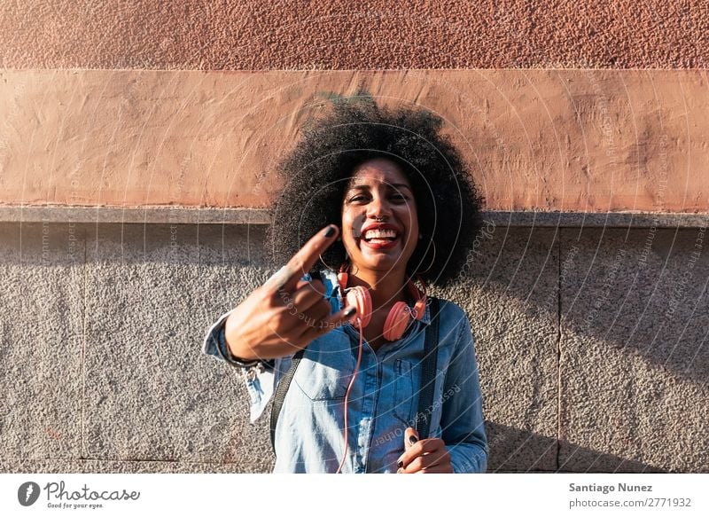 Beautiful afro american woman to throw up horns. Woman Black African Afro Human being Portrait photograph Hand Fingers City Youth (Young adults) Girl American