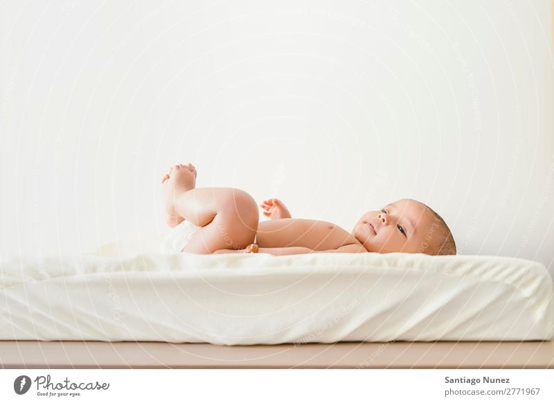 Cute Baby Girl Lying in the Baby Changer. Boy (child) Child baby changer Lie (Untruth) Newborn Beautiful Portrait photograph Human being Caucasian Face Eyes