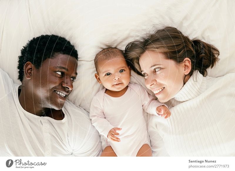 Happy Family, Mother, Father And Baby. Boy (child) Child Bed Girl Lie (Untruth) Newborn Parents Family & Relations multiethnic Love African diverse Human being