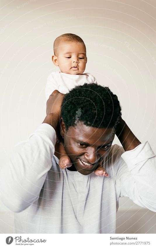 Happy Father and baby Have Fun. Baby Boy (child) Child piggybacking Girl Family & Relations Love Hold Newborn multiethnic Parents Black African diverse