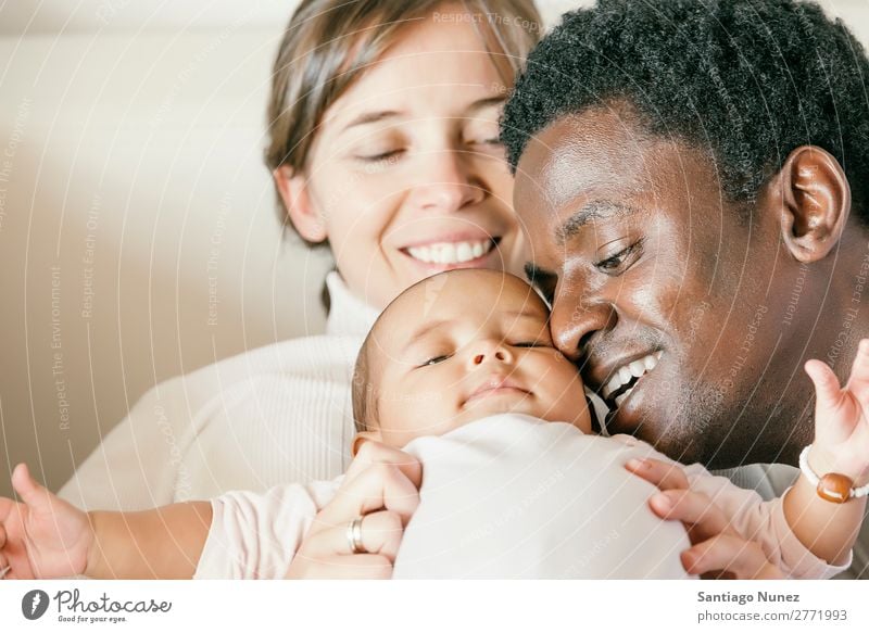 Happy Family, Mother, Father And Baby. Boy (child) Child Family & Relations Love Kissing Bed Girl Lie (Untruth) Newborn Parents multiethnic African diverse