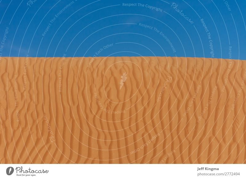 Sand Dune Designs with a Blue Sky in the UAE Desert. Beautiful Vacation & Travel Summer Beach Mountain Wallpaper Nature Hill Natural Brown Yellow Gold Colour