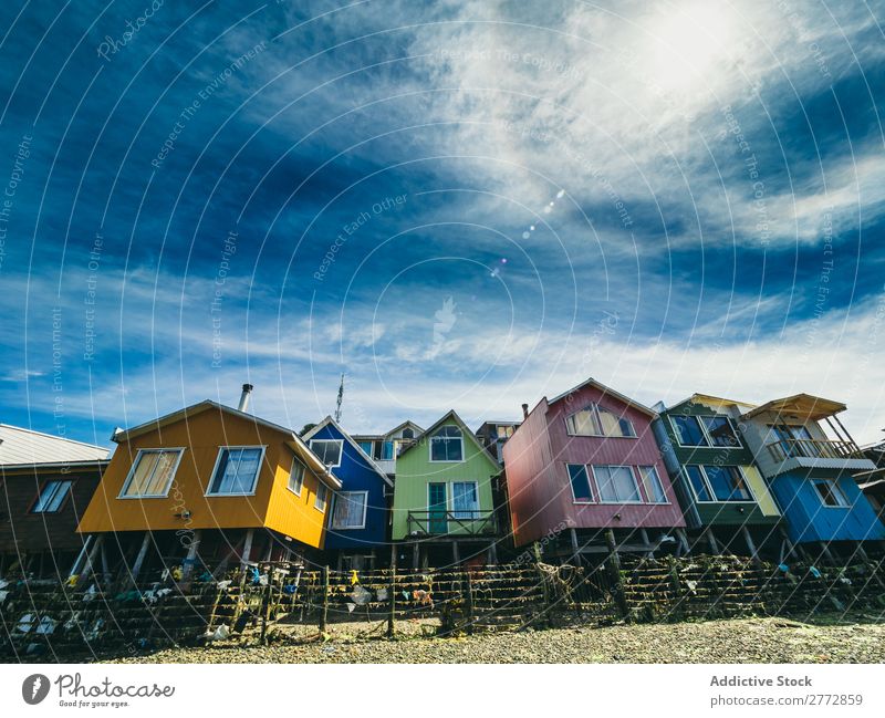 Colorful houses on piles House (Residential Structure) Accumulation Coast Landscape Beach Architecture Rural Tourism Bright Facade Nature Tradition