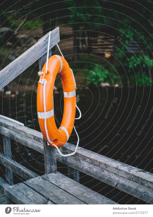Life saver on pier in lake Jetty safety ring Lake Safety (feeling of) Summer Lakeside Protection Rural Circle Wood lifesaver Ring Orange Rescue Water Deserted