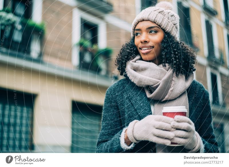 Young black woman drinking coffee wandering in the streets of Madrid on winter Woman Vacation & Travel City Town center Spain Exterior shot Student Cute Street