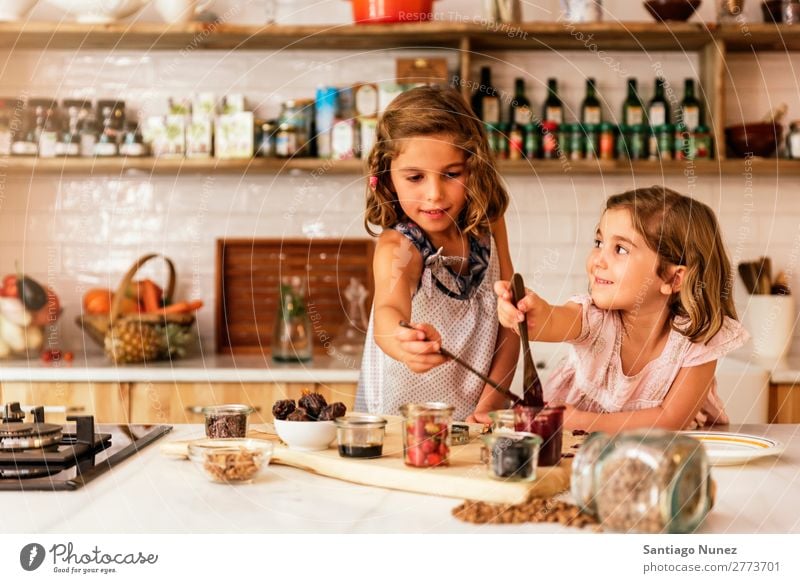 Little sisters girl preparing baking cookies. Child Girl Cooking Kitchen Chocolate Ice cream Strawberry Daughter Day Happy Joy Family & Relations Love