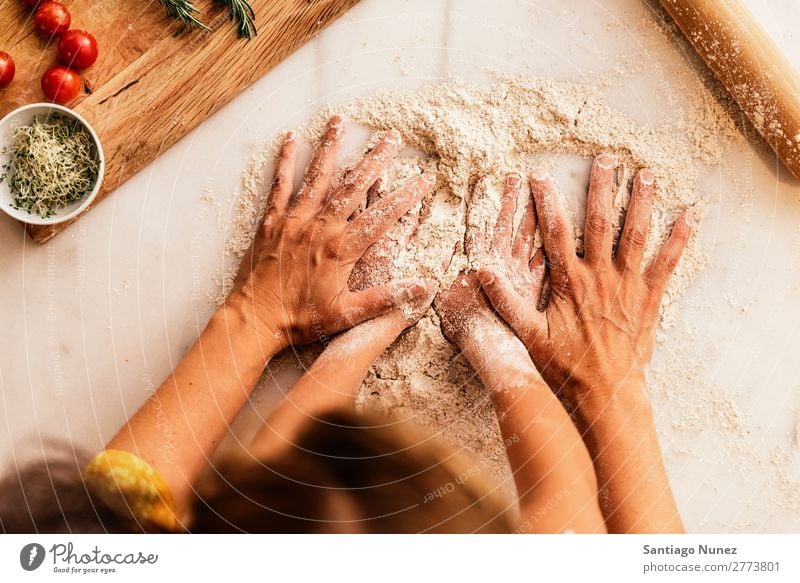 Little girl kneading flour with her mother. Child Girl Hand Mother Cook Cooking Kitchen Flour Dough Daughter Day Happy Joy Family & Relations Love Baking Food
