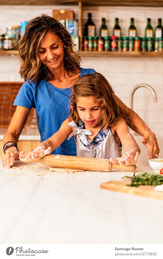 Little child girl kneading dough prepare for baking cookies. Mother Girl Cook Cooking Kitchen Flour Chocolate Daughter Day Happy Joy Family & Relations Love