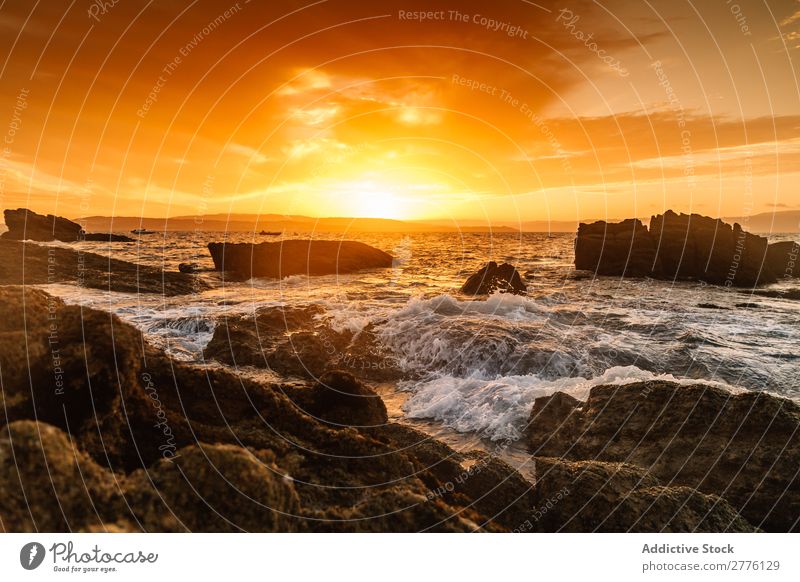 Picturesque view of sun above ocean Landscape Ocean Tide Coast Sunset Summer Splashing magical Vacation & Travel Rock Panorama (Format) tranquil Magic Natural