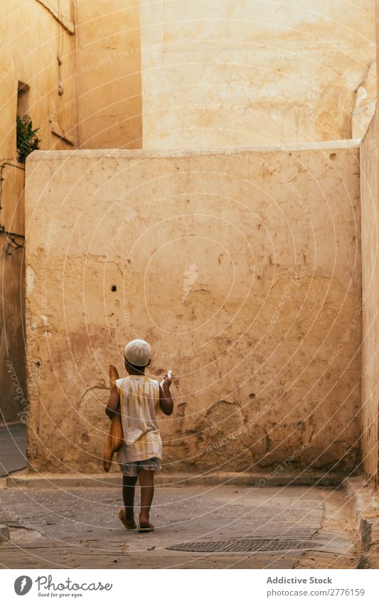 Black boy walking at streets Town Child Street Tradition Lifestyle Exotic Old Culture Architecture Boy (child) Township Infancy Vacation & Travel Stone City