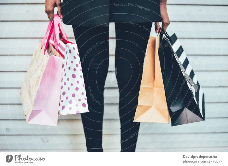 Woman legs with colourful shopping bags Shopping Christmas & Advent Bag Sale Legs Vacation & Travel Black Mixed race ethnicity Reyes magos American African Girl