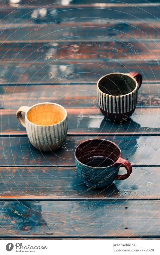 A couple of earthen cups with coffee and herbal tea Herbs and spices Coffee Tea Lifestyle Design Summer Decoration Table Craft (trade) Hand Art Nature Rain Wood
