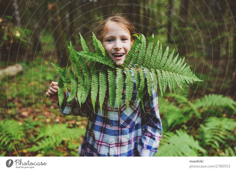 kid girl exploring summer forest, playing with ferns Lifestyle Happy Playing Vacation & Travel Adventure Freedom Expedition Summer Hiking Child Infancy Nature