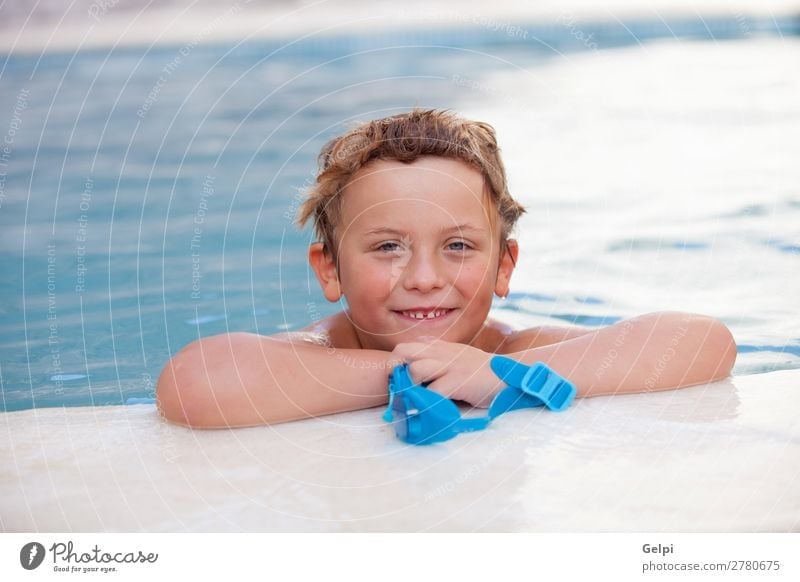 Funny blond boy in the pool Lifestyle Joy Happy Relaxation Swimming pool Leisure and hobbies Playing Vacation & Travel Summer Sports Child Human being