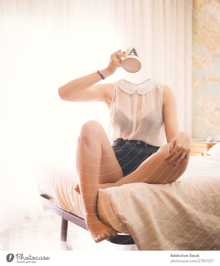 Headless woman siiting on bed and drinks Woman Faceless without head Cup Mug Liquid Beverage Hold Drinking Hand Arm Top White Transparent Denim pose Mystic
