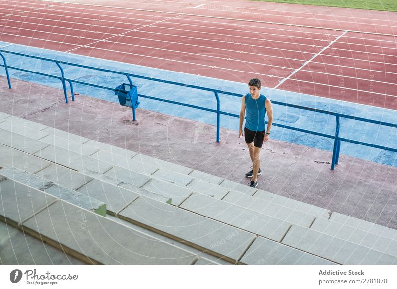 Sportsman running upstairs on stadium Man Stadium Running Stairs Fitness sportsman Practice workout Athletic Action Muscular Healthy sprint Youth (Young adults)