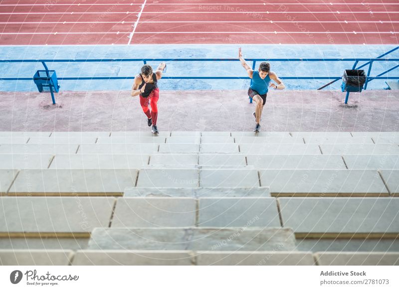 Two sportsmen running up stairs Stadium Running Stairs Fitness Practice workout Athletic Action Muscular Healthy sprint 2 Youth (Young adults) Athlete Sports