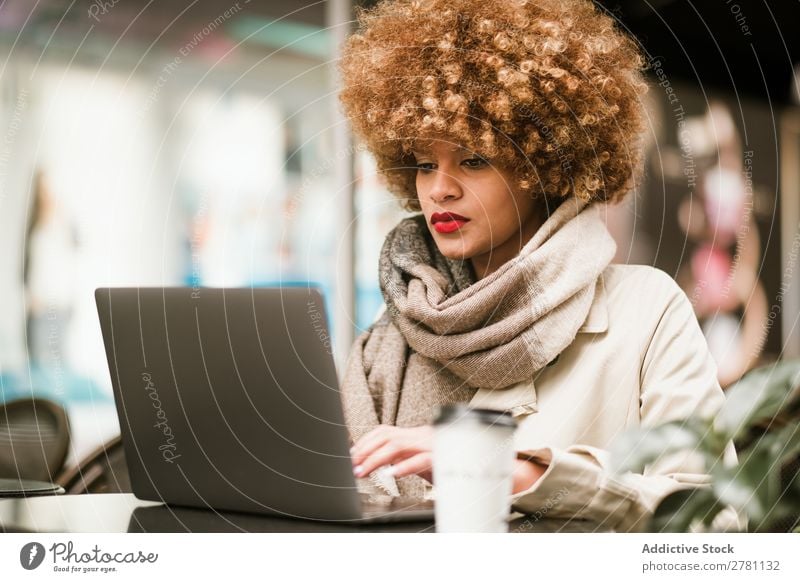 Stylish young woman using laptop in cafe Woman Style Adults pretty Hair and hairstyles Café Notebook browsing Coffee Blonde Beautiful Attractive Fashion Model