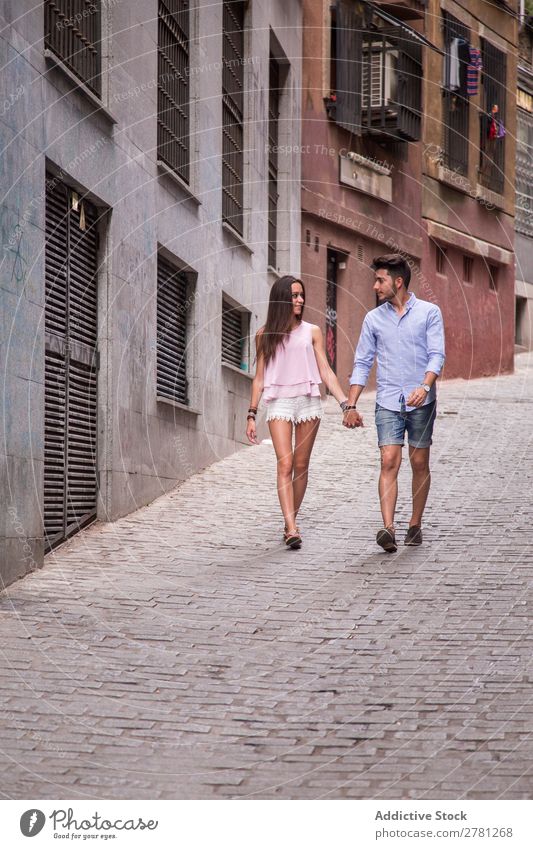 Young lovers walking on street Couple Happy Hold Hand Walking Woman Face to face Style tender Man Human being Love Lifestyle romantic Caucasian