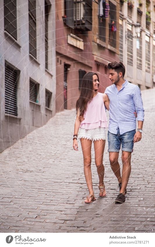 Happy couple walking on street Couple Embrace Walking Woman Face to face Style tender Man Human being embracing Love Lifestyle romantic Caucasian