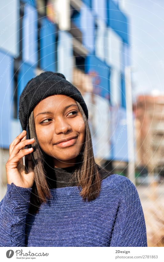 Portrait of a cheerful young african woman standing outdoors Style Joy Beautiful To talk Telephone PDA Technology Human being Feminine Young woman